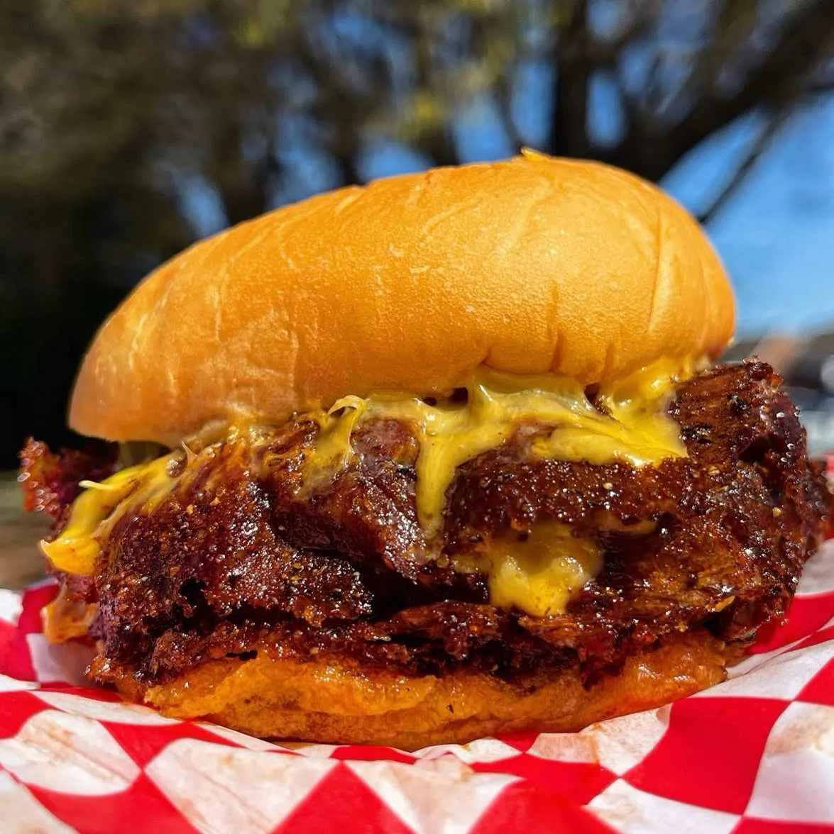 A smash burger with melted cheese and a crisp beef edge