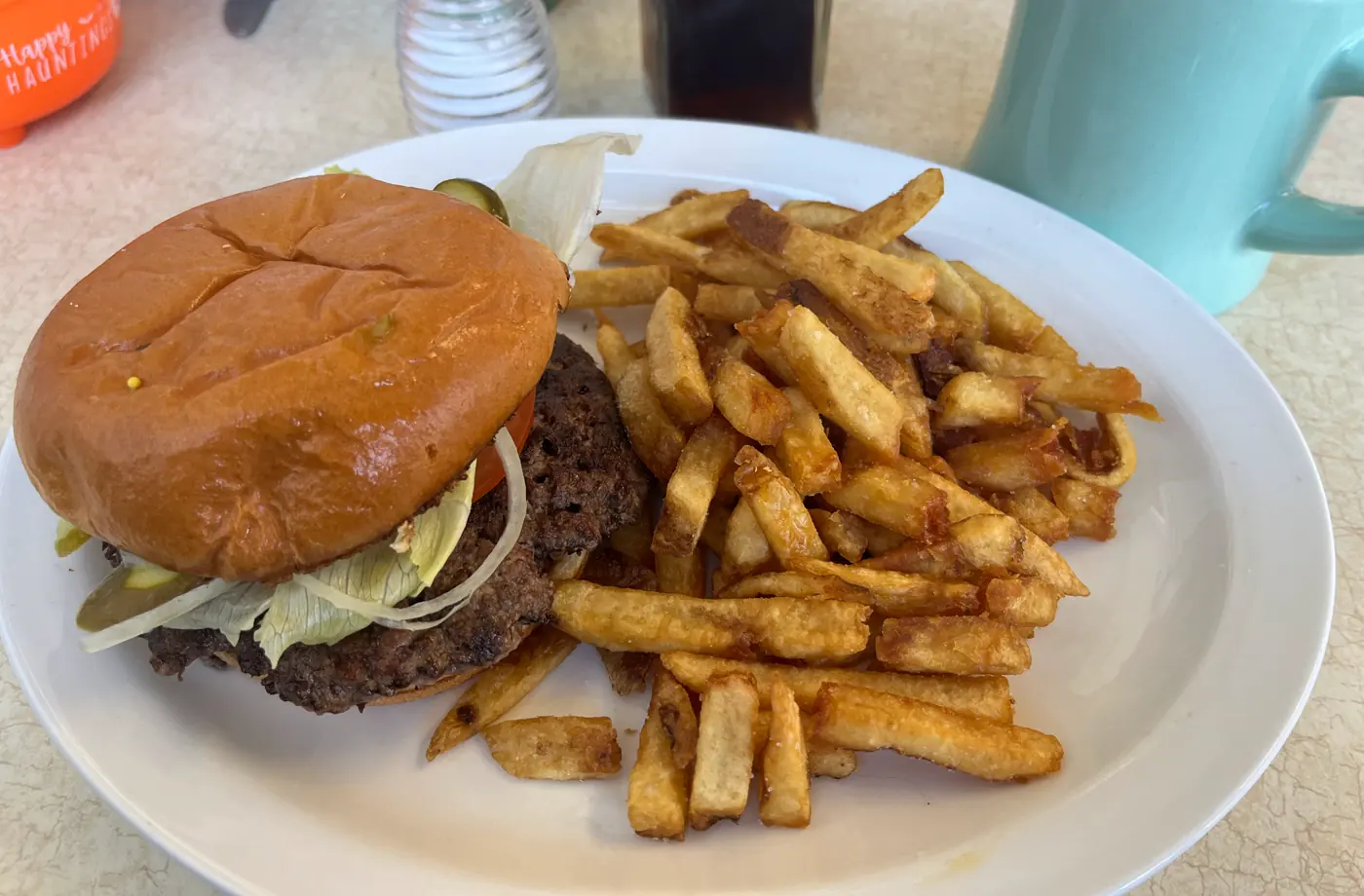 Stock smashburger with cheese, pickles, and fries