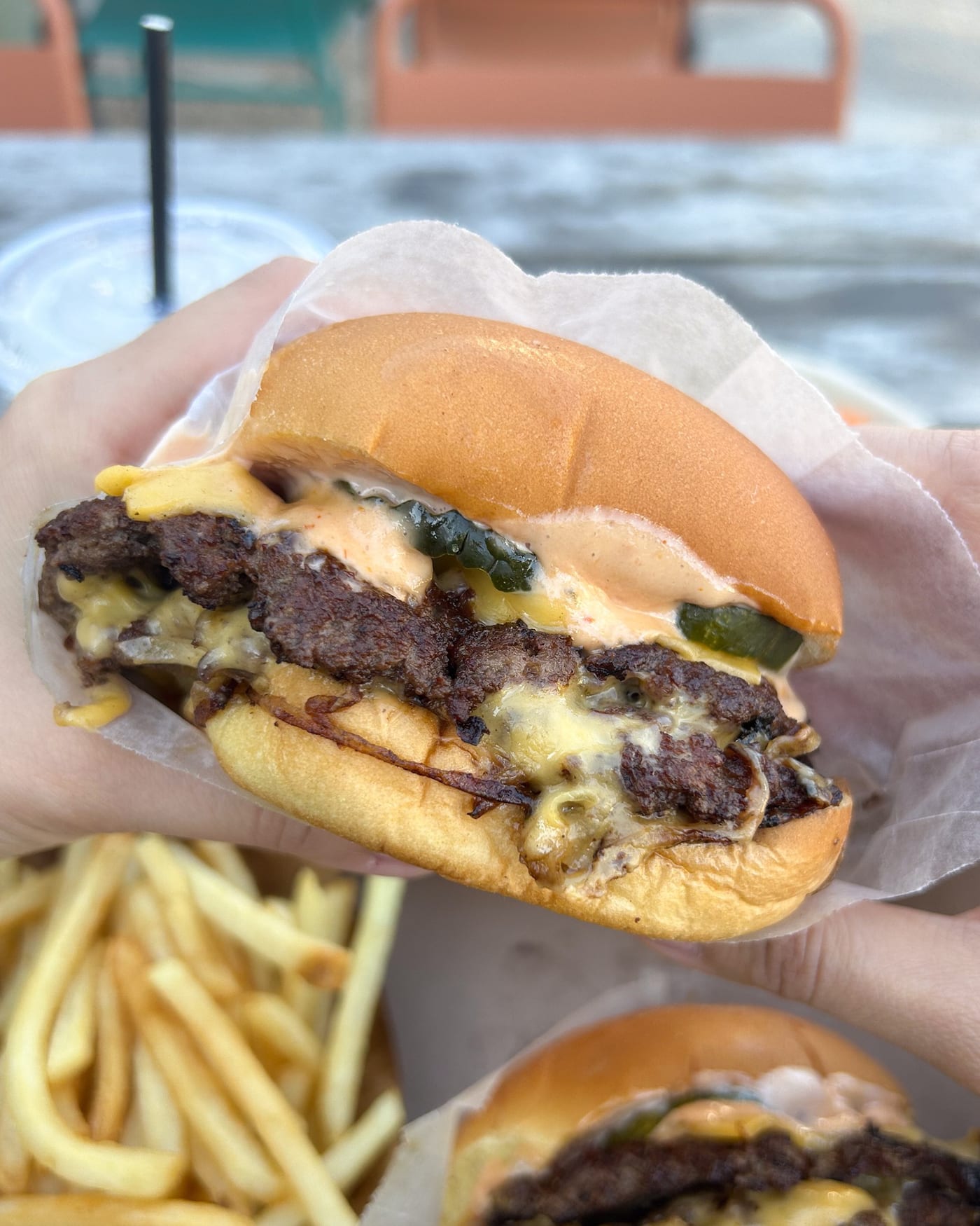 The Win-Dow cheeseburger detail with American cheese and pickles