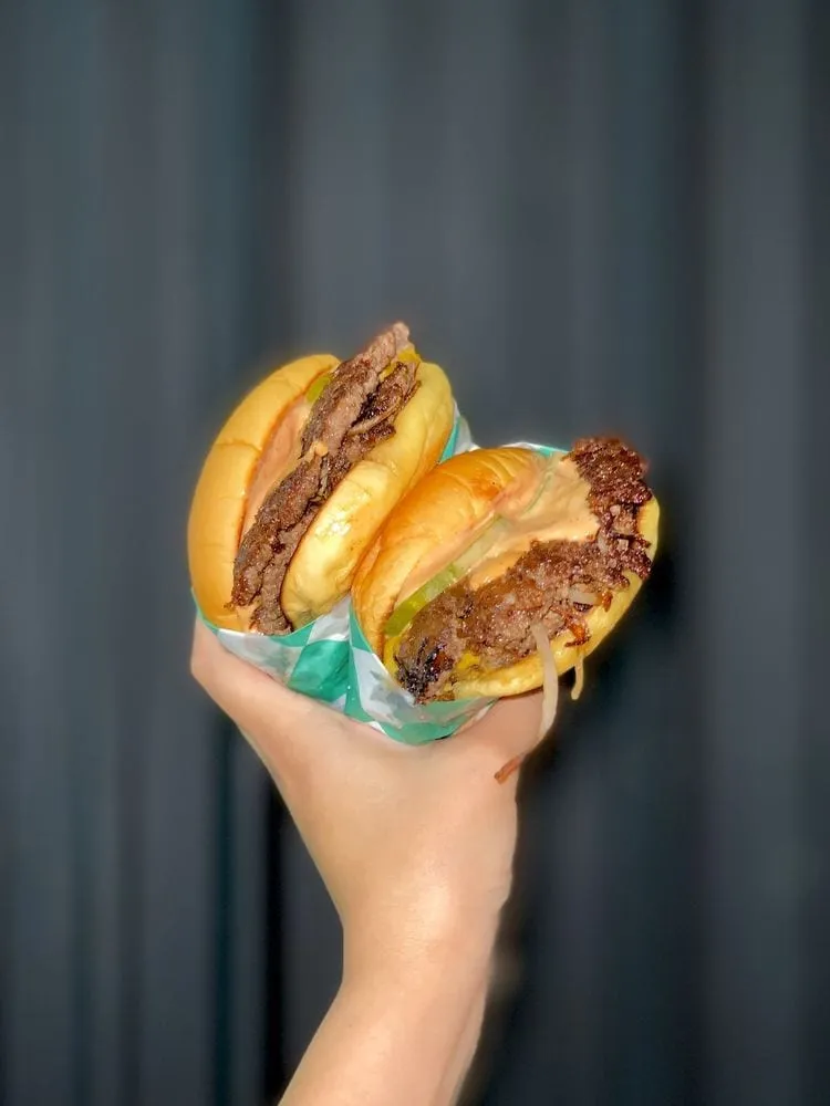 Maillards smashburger close-up with crispy paper-thin patties and melted American cheese