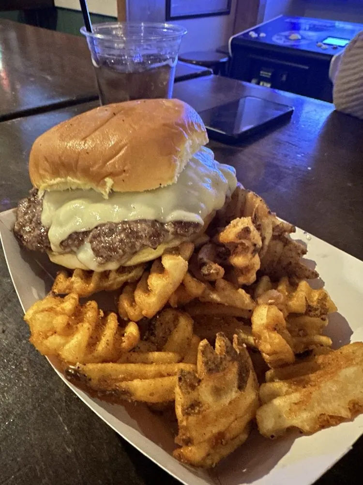 Dalton's double cheeseburger with Cooper Sharp cheese, onion and pickles