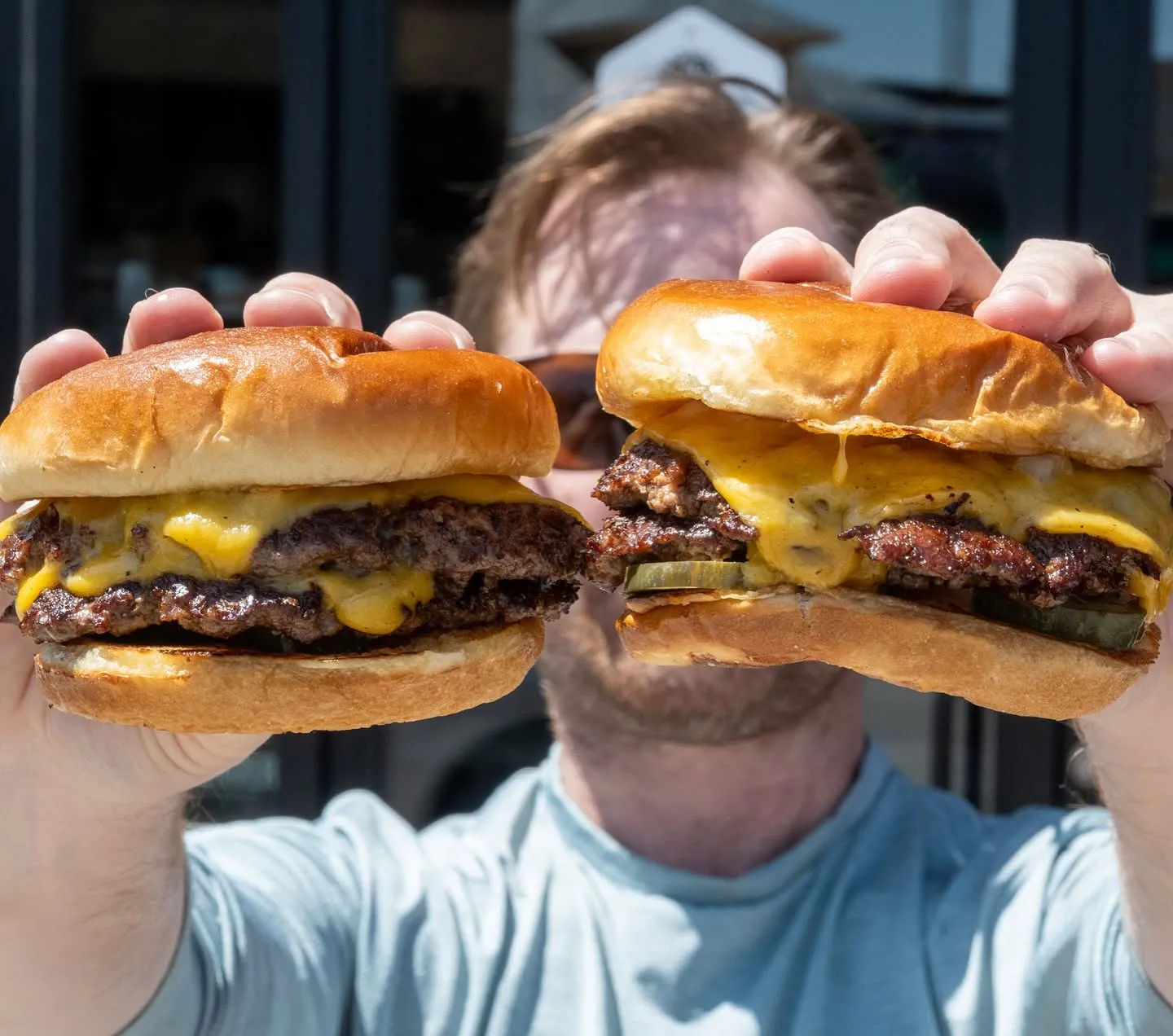 Fat Sully's Lights Out smashburger with crisp beef edges, cheese and pickles
