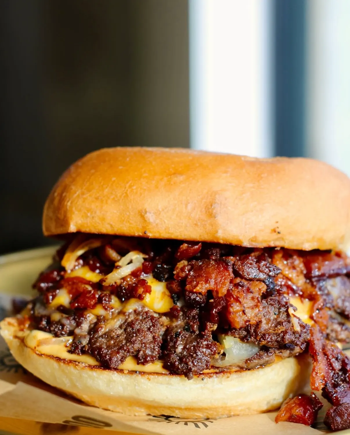 Double OD Burger close-up with dilly pickled onions