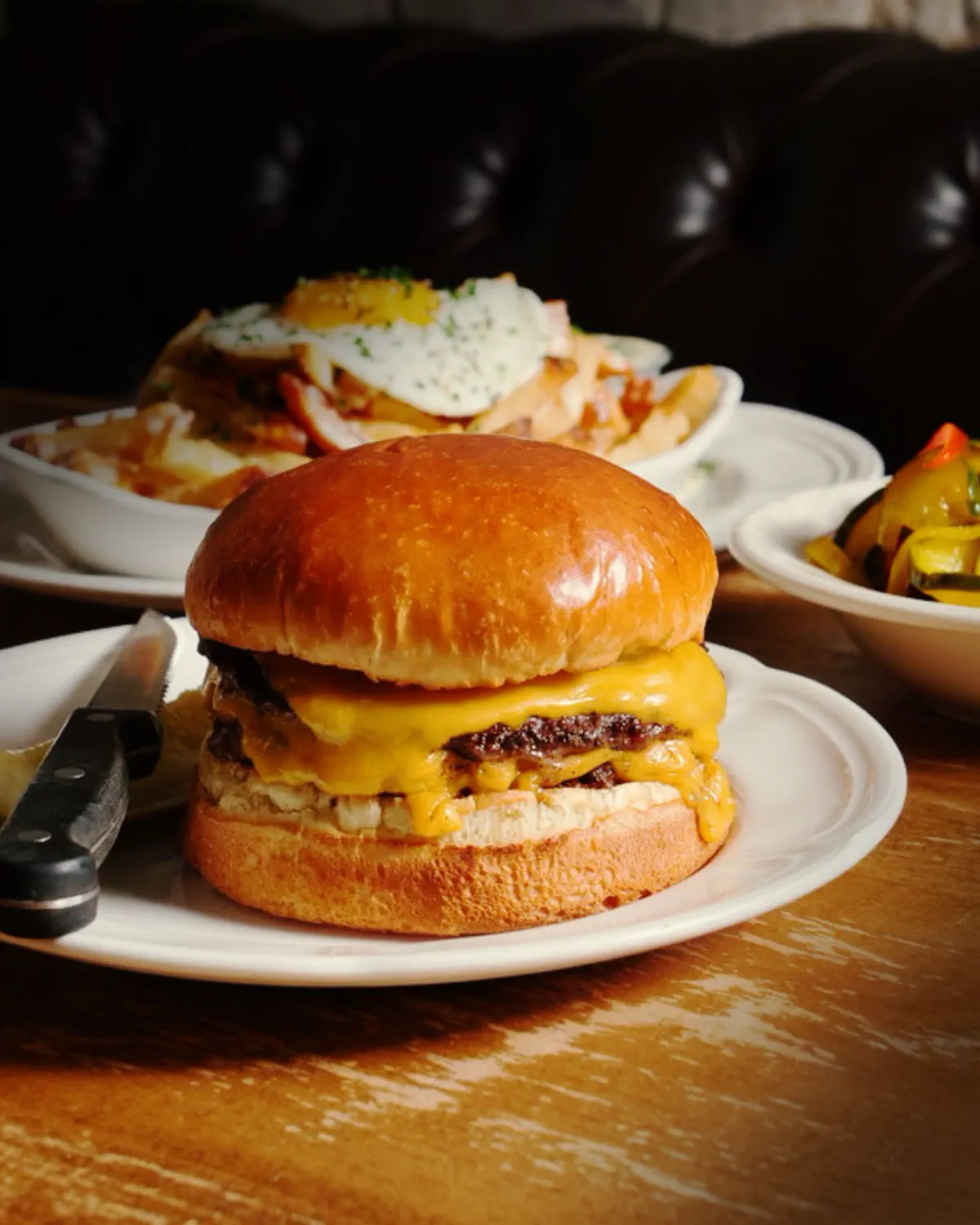 Au Cheval cheeseburger close-up with melted cheese