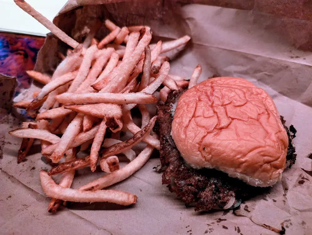 Best Intentions interior with knickknacks, bar seating, and communal tables