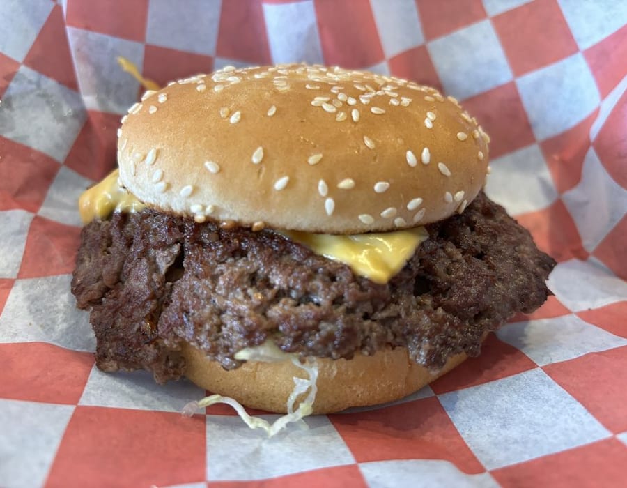 PrimeTime smashburger fries loaded with chopped patties, cheese, grilled onions, and jalapeños