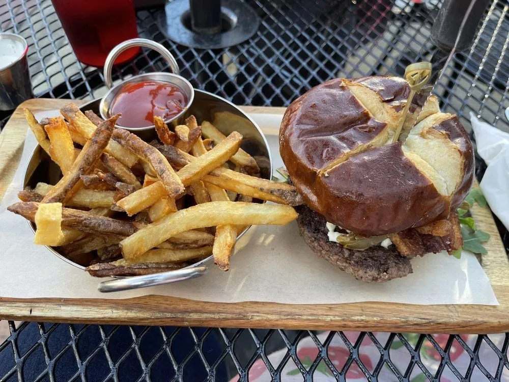 Replay Andersonville burger with bacon, arugula, and hand-cut fries