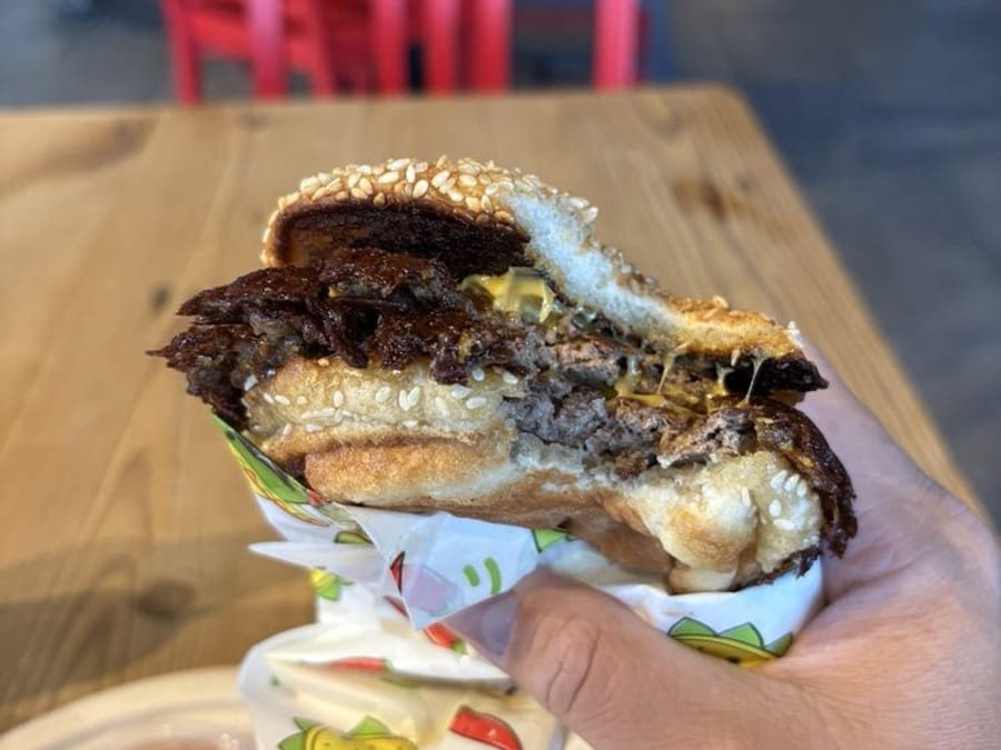 Taco Sublime OKC smash burger with fries — crispy edge patties visible