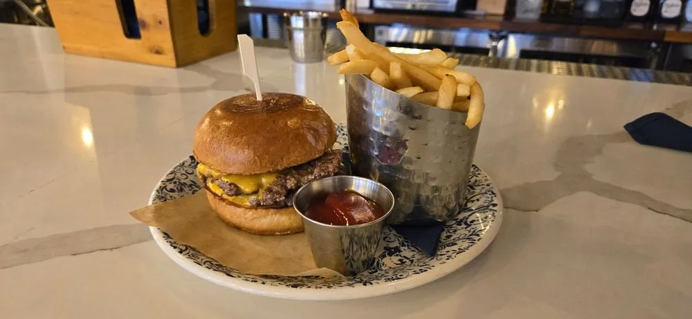 The Hampton Social smash cheeseburger with french fries