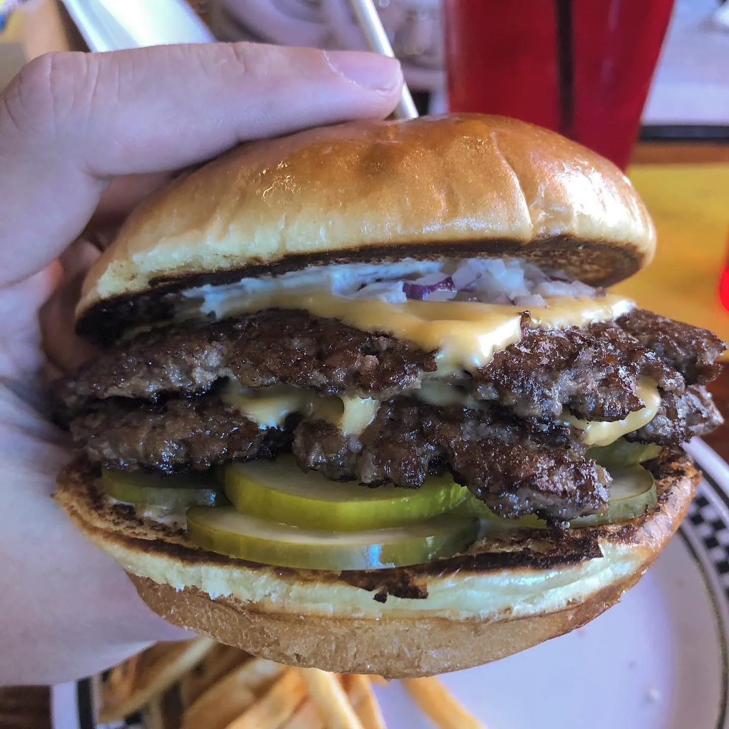 The StopAlong burger close-up with melted cheese