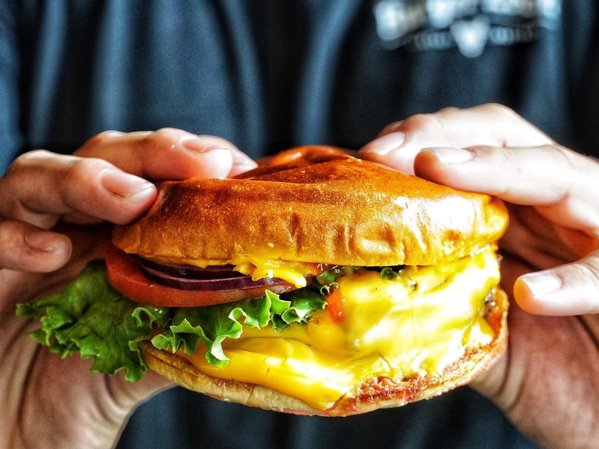 The Classic Melt at The Burger Local - double smashed wagyu with Swiss and American on marbled rye