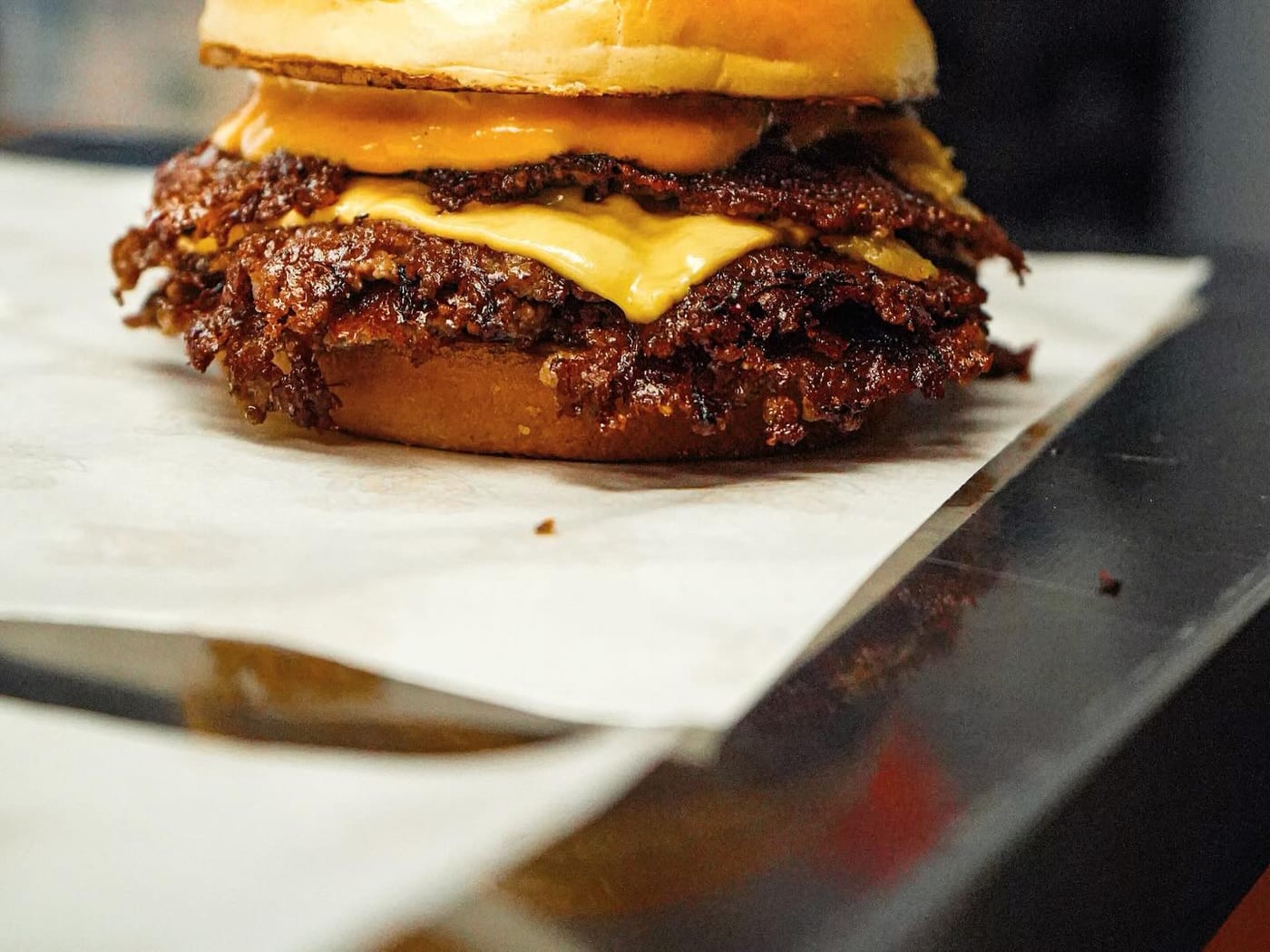 Out Cold Knockout Fries smothered in cheese sauce, caramelized onions, pickles and knockout sauce