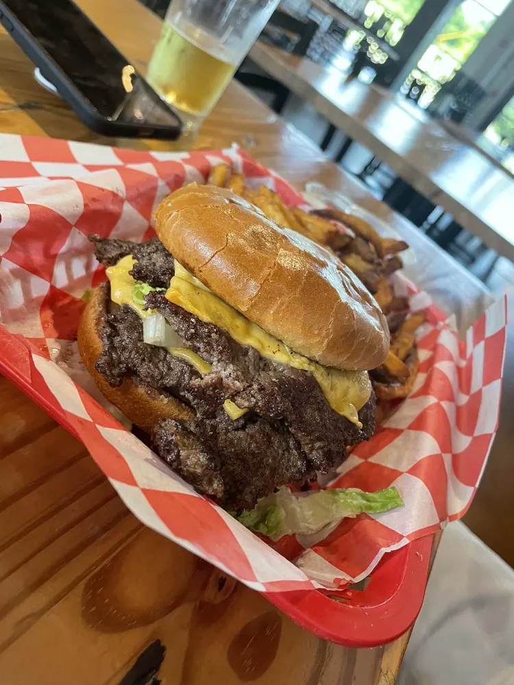 Juicy Brewcy Smash Burger - pub-cheese-stuffed double smash patty at Daredevil Hall