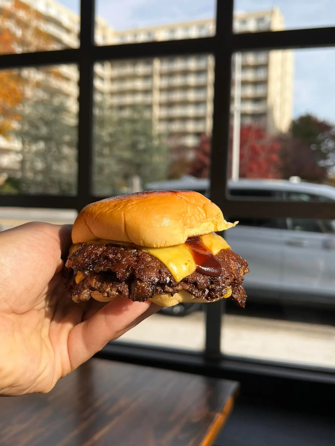 Bun N Done classic smashburger with American cheese and sauce