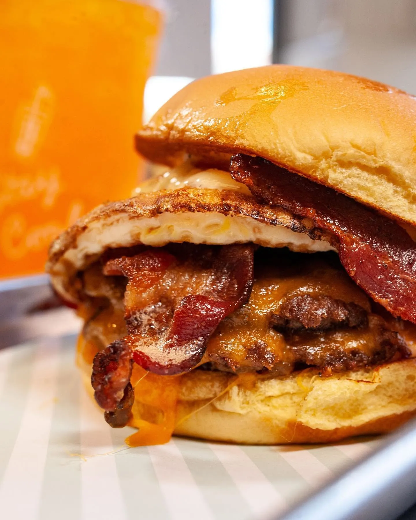 Diesel & Duke bacon and egg smash burger with melted cheese