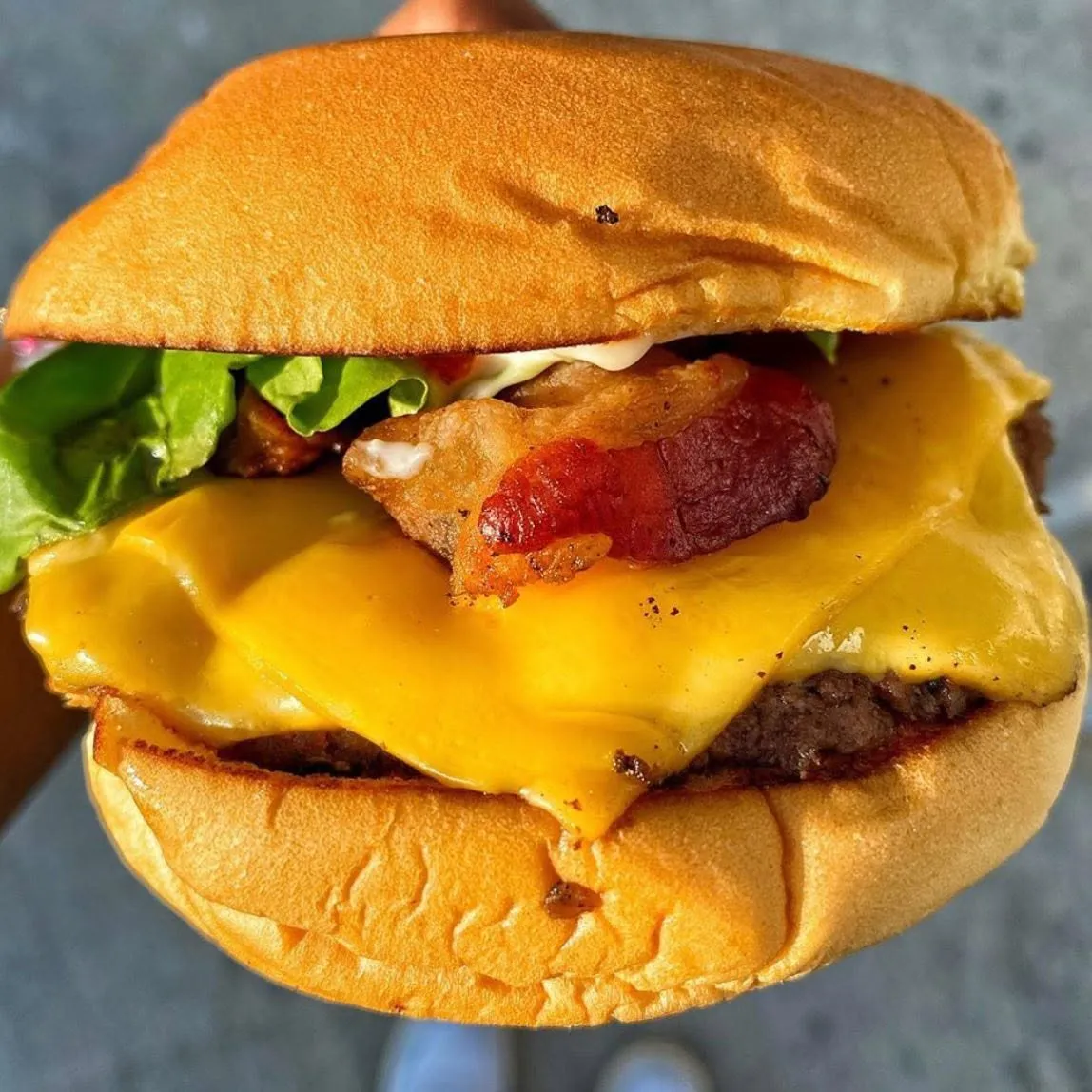 Diesel & Duke bacon cheeseburger with lettuce and house sauce