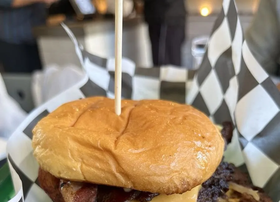 Oh Boy smashburger with craggy seared patties and melted American cheese