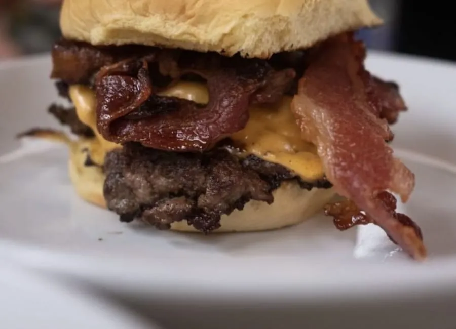 Oh Boy burger on a plate with crisp smashed edges and potato roll