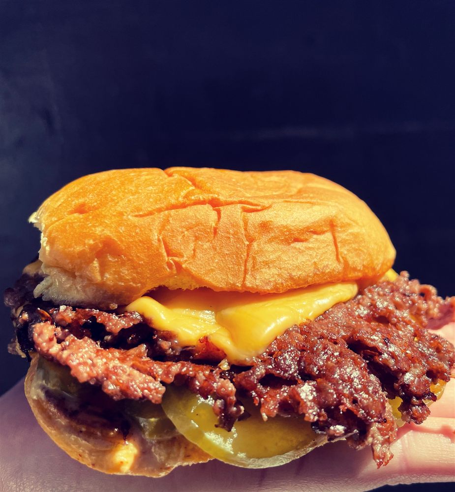 Close-up of crispy lace-edged patties at Dreamburger Nashville