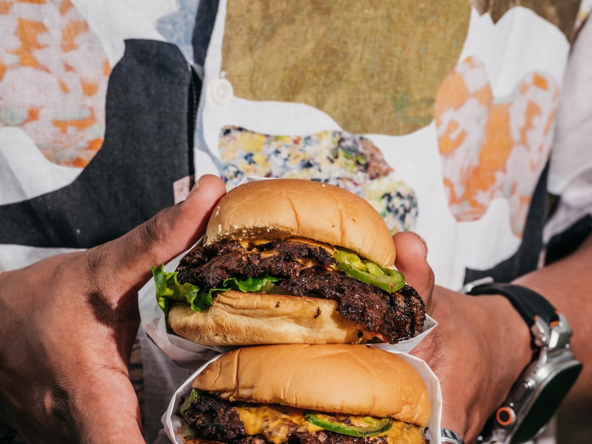 JABS KO triple smashburger cross-section showing crispy sear layers