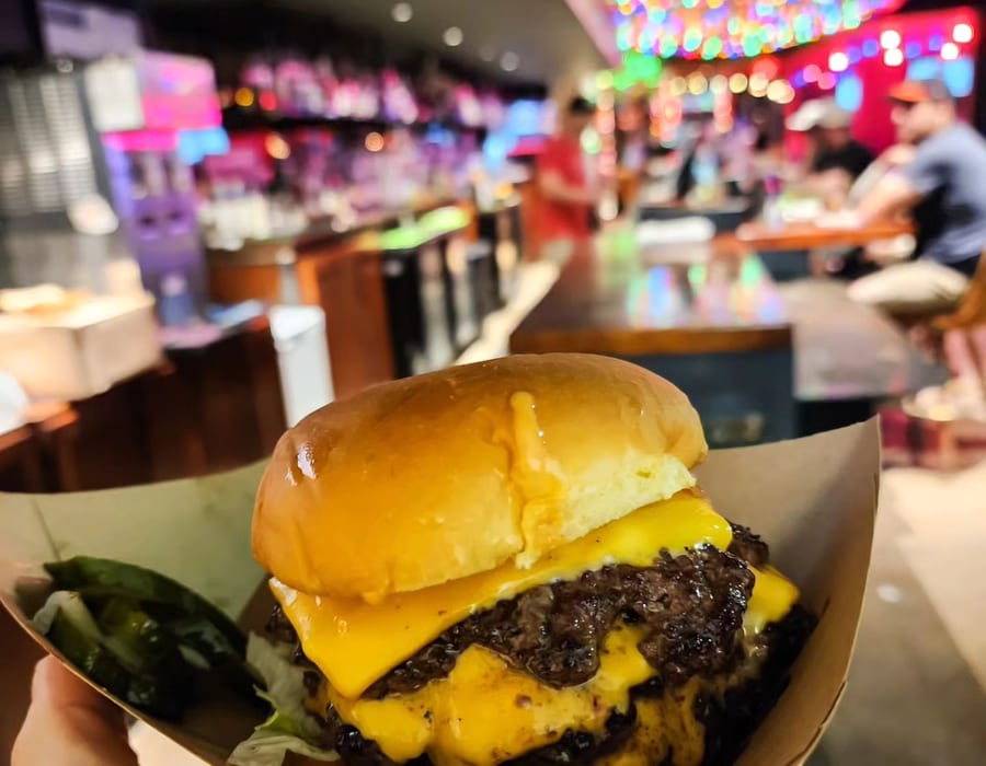 Thunder Chief smashburger cross-section showing pink wagyu patties and crispy sear