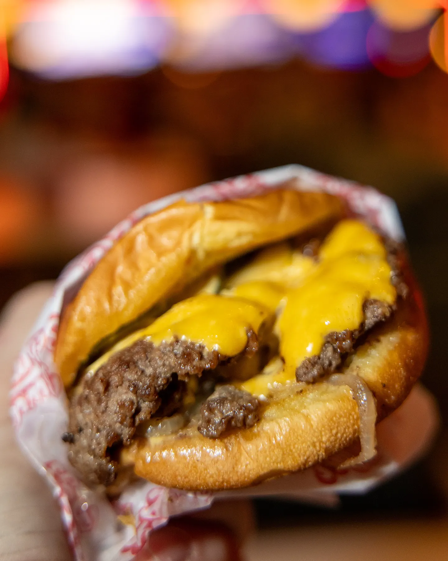 The Maverick burger, a double smash with smoked pork belly jam and inverted bun