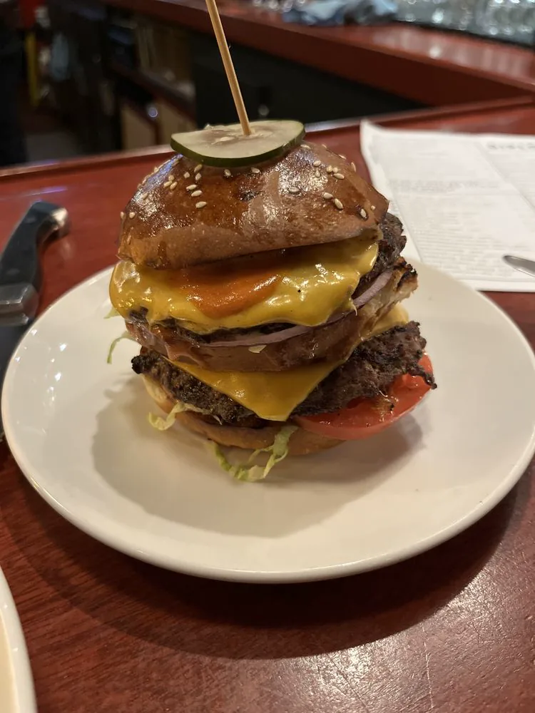The Diplomat burger close-up with melted cheese